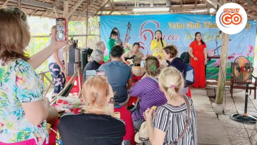 Cai Rang floating market tour and a tropical fruit garden 23 Enjoy the traditional kind of music