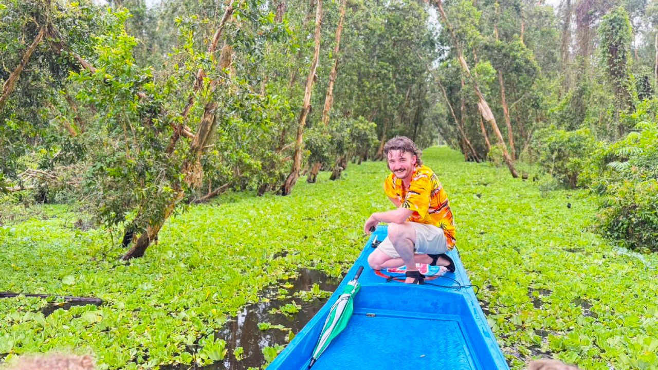 Take a motor boat to explore Tra Su forest