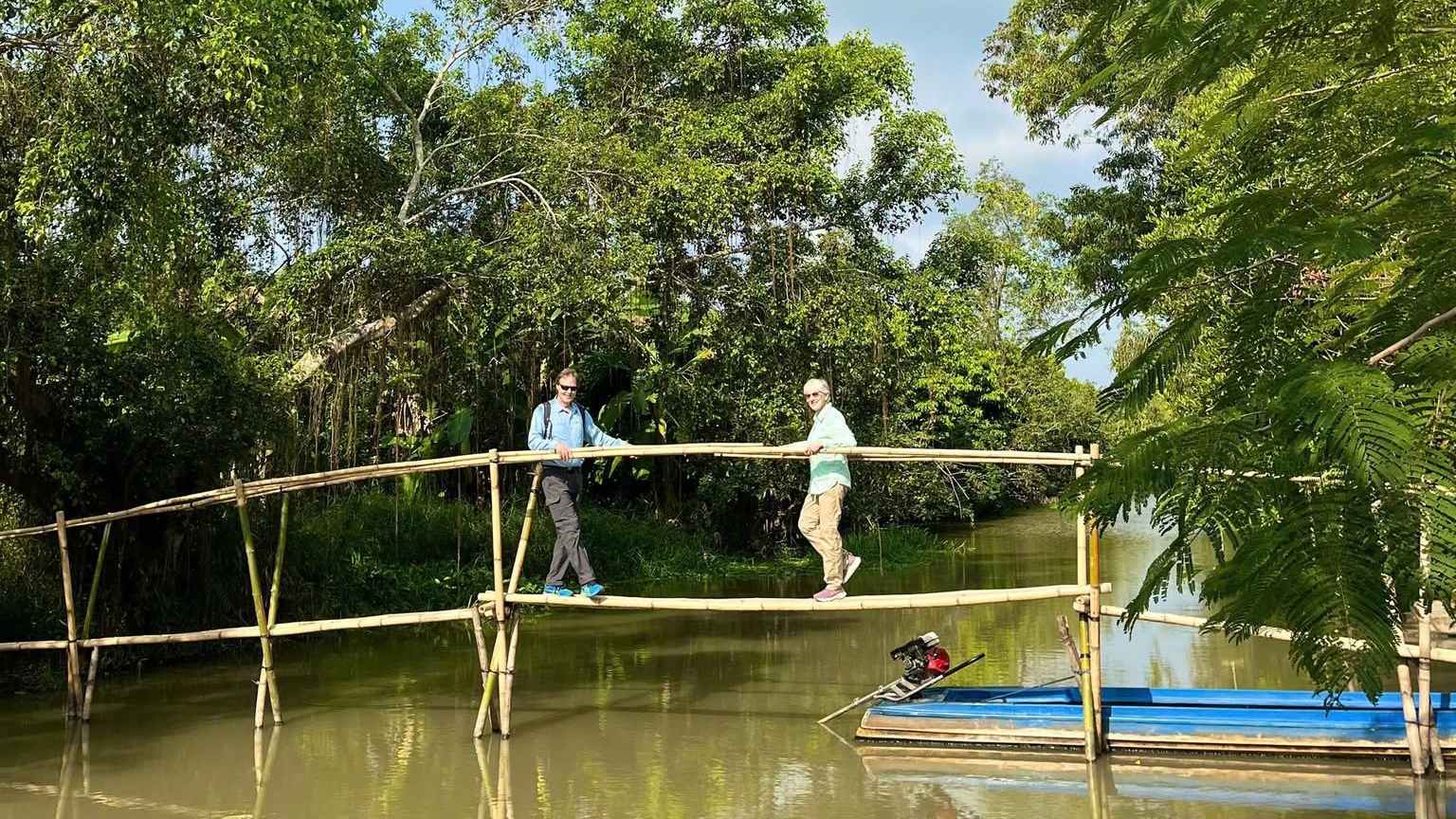 Tourist experience crossing a "monkey bridge" at Lung Ngoc Hoang forest