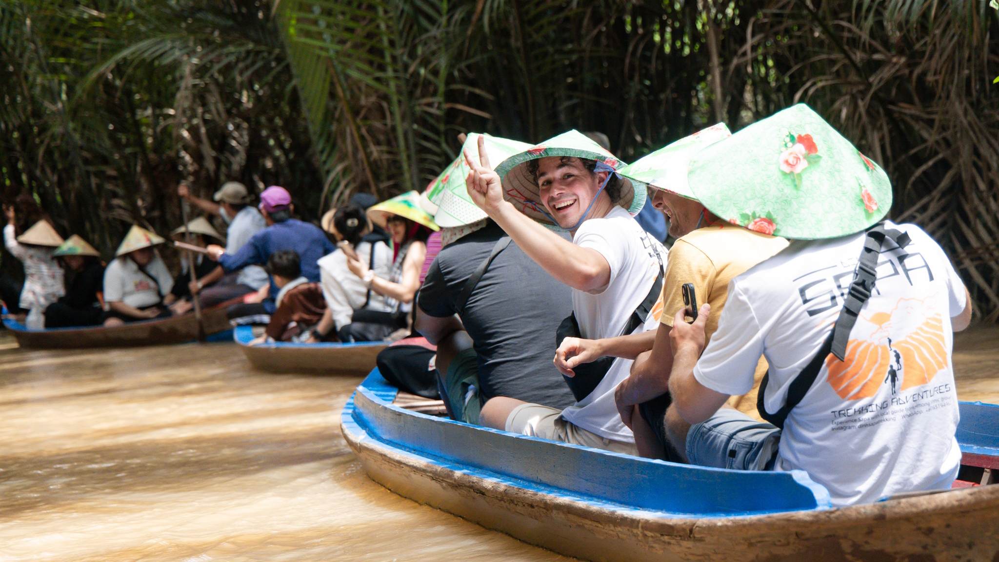 Tourists enjoying a sampan ride in Thoi Son islet (Ben Tre)